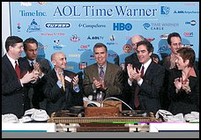 Time Warner's Gerald Levin, center, and AOL's Robert Pittman, (by emonies marking the companies' merger. <img .producer=
